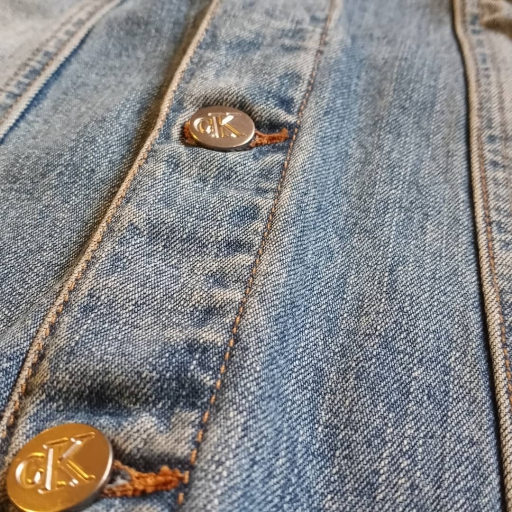 Mid blue faded denim trucker jacket